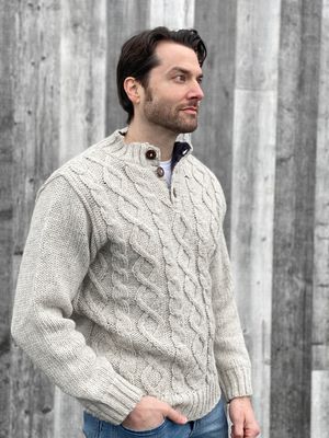 Cable-knit sweater styled with classic blue jeans