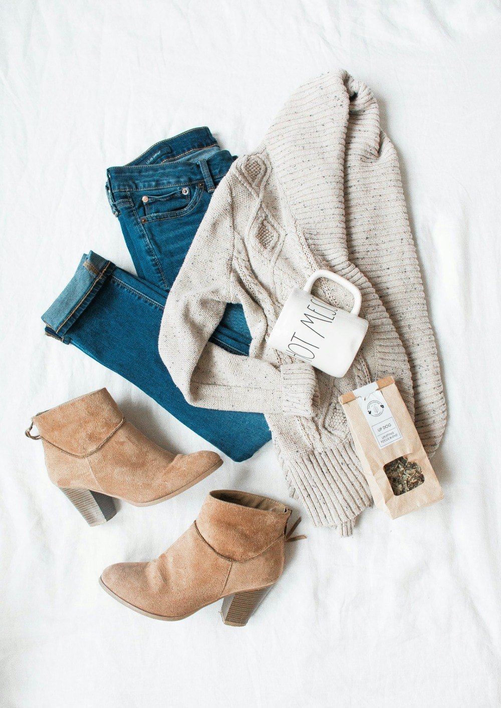 Cozy outfit flat lay with beige boots