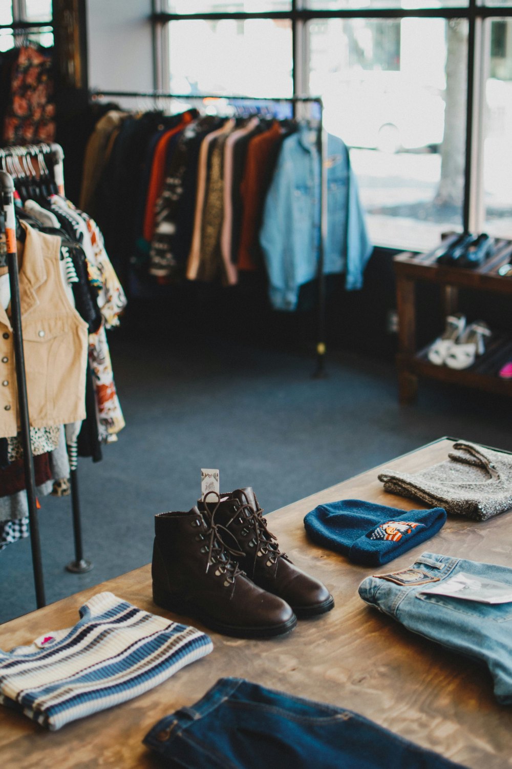 Rustic store interior featuring trendy clothing racks