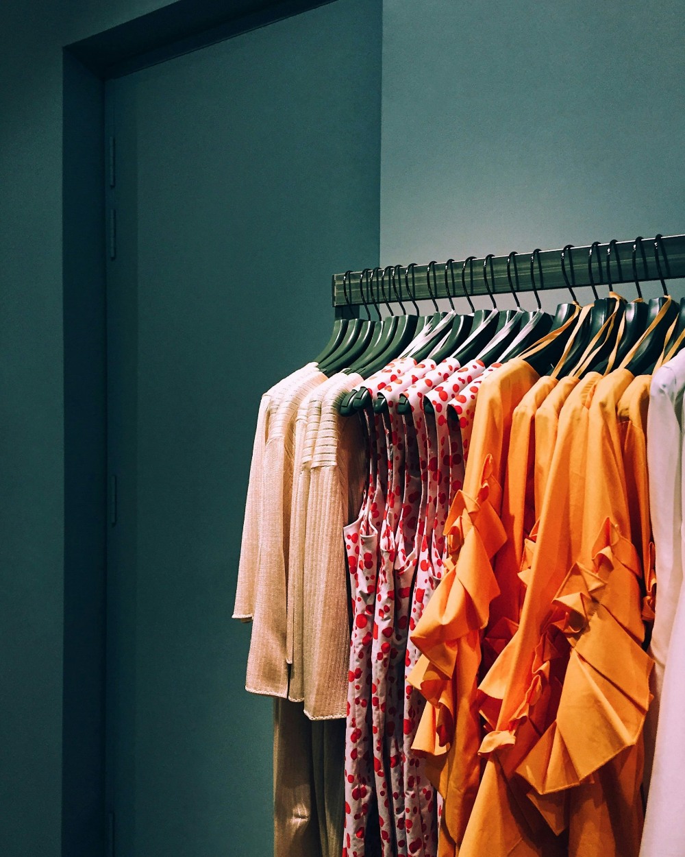 Clothes hanging neatly on a minimalist rack